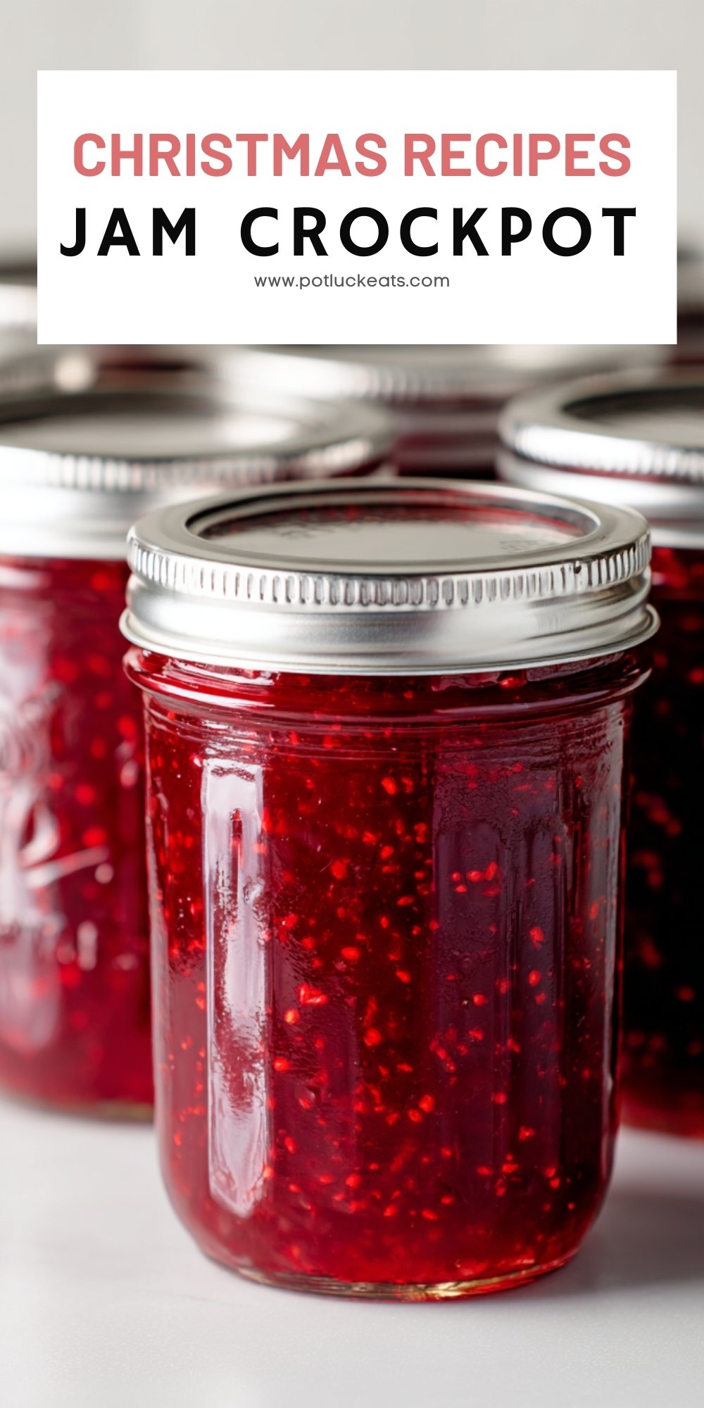 Group of mason jars filled with bright red crockpot Christmas jam, perfect for holiday gifting.