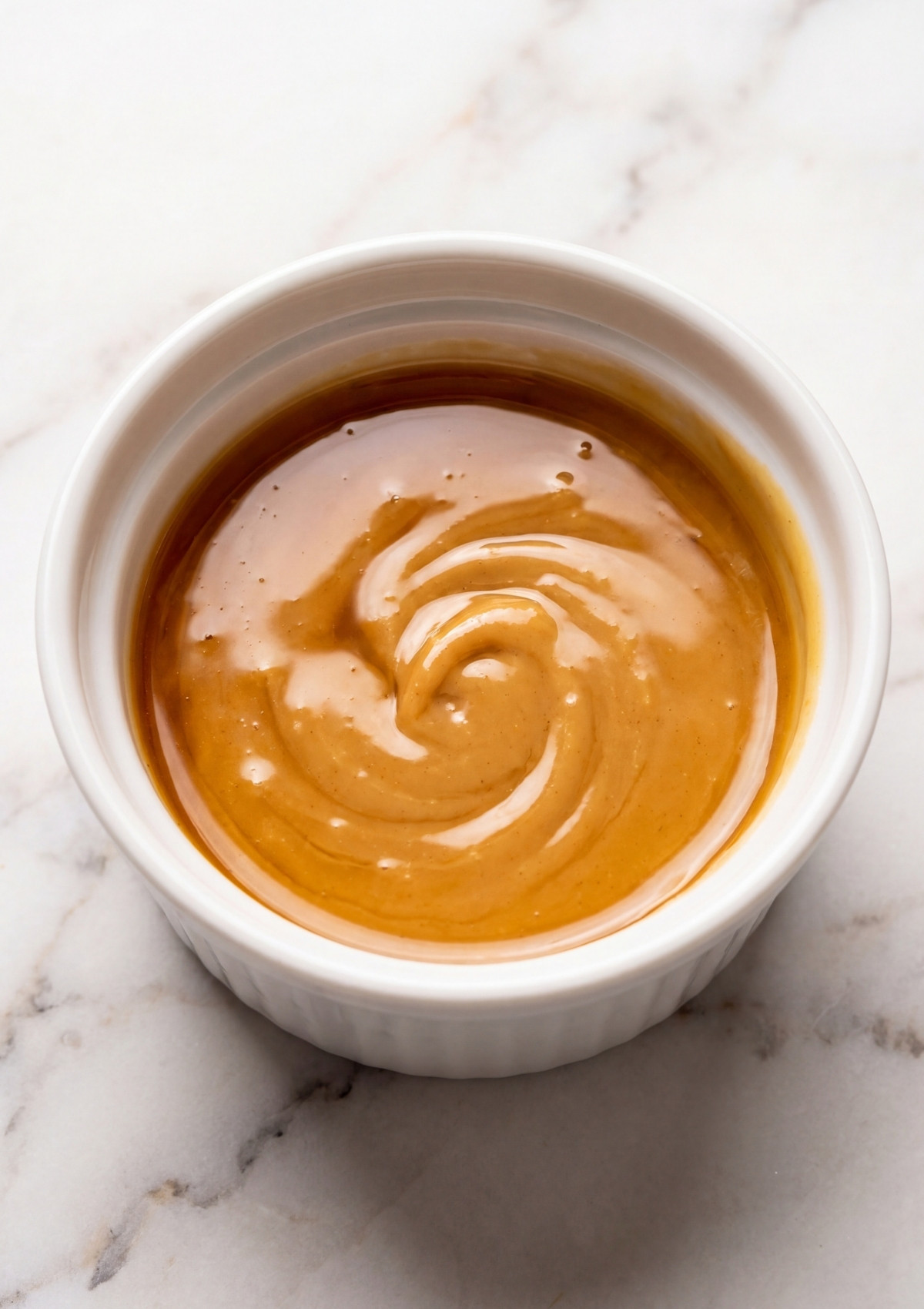 Peanut butter and maple syrup melted together for No Bake Oatmeal Bars easy 3 ingredient healthy snack recipe