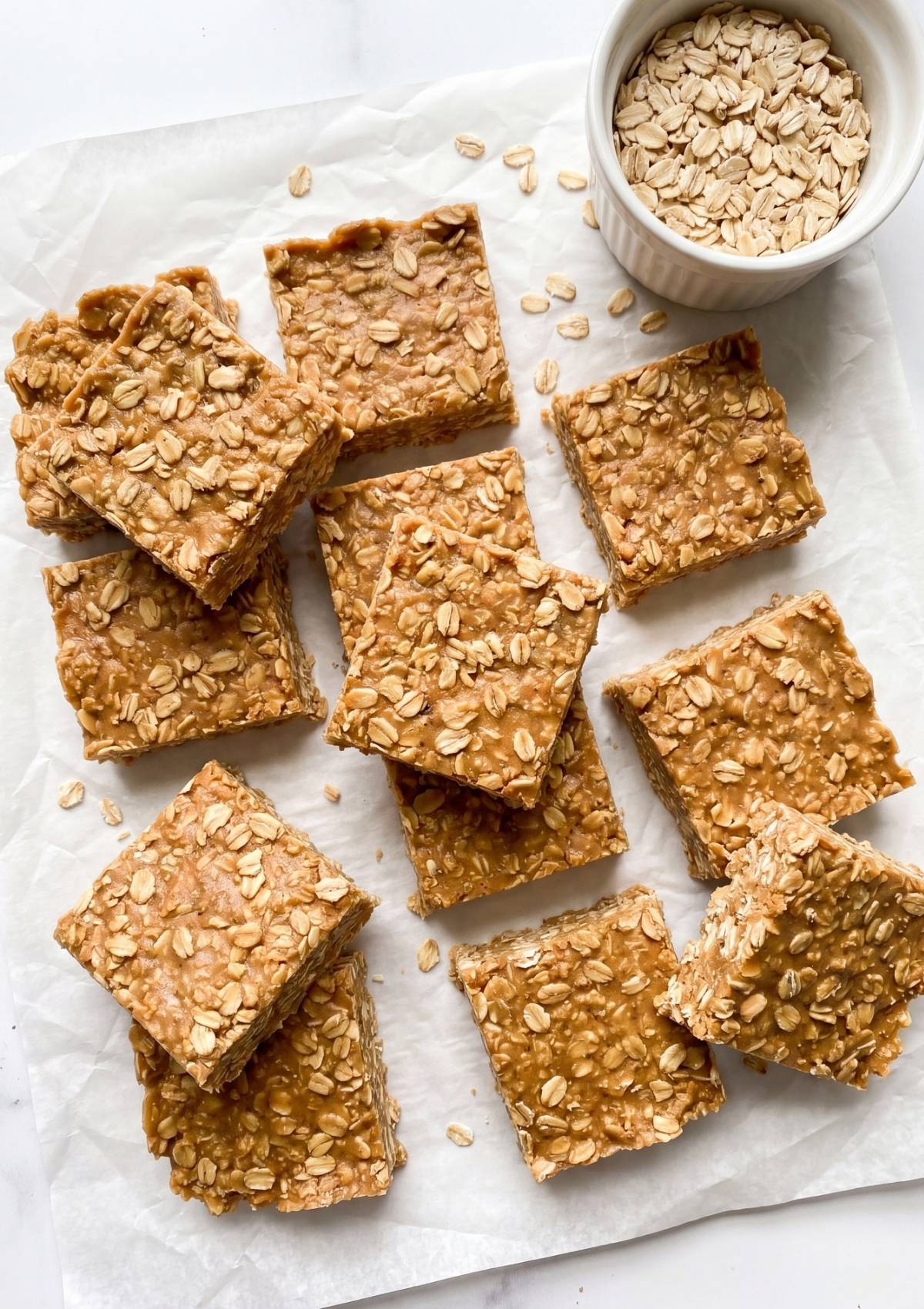 No Bake Oatmeal Bars on parchment paper with oats simple no bake dessert quick snack and breakfast idea