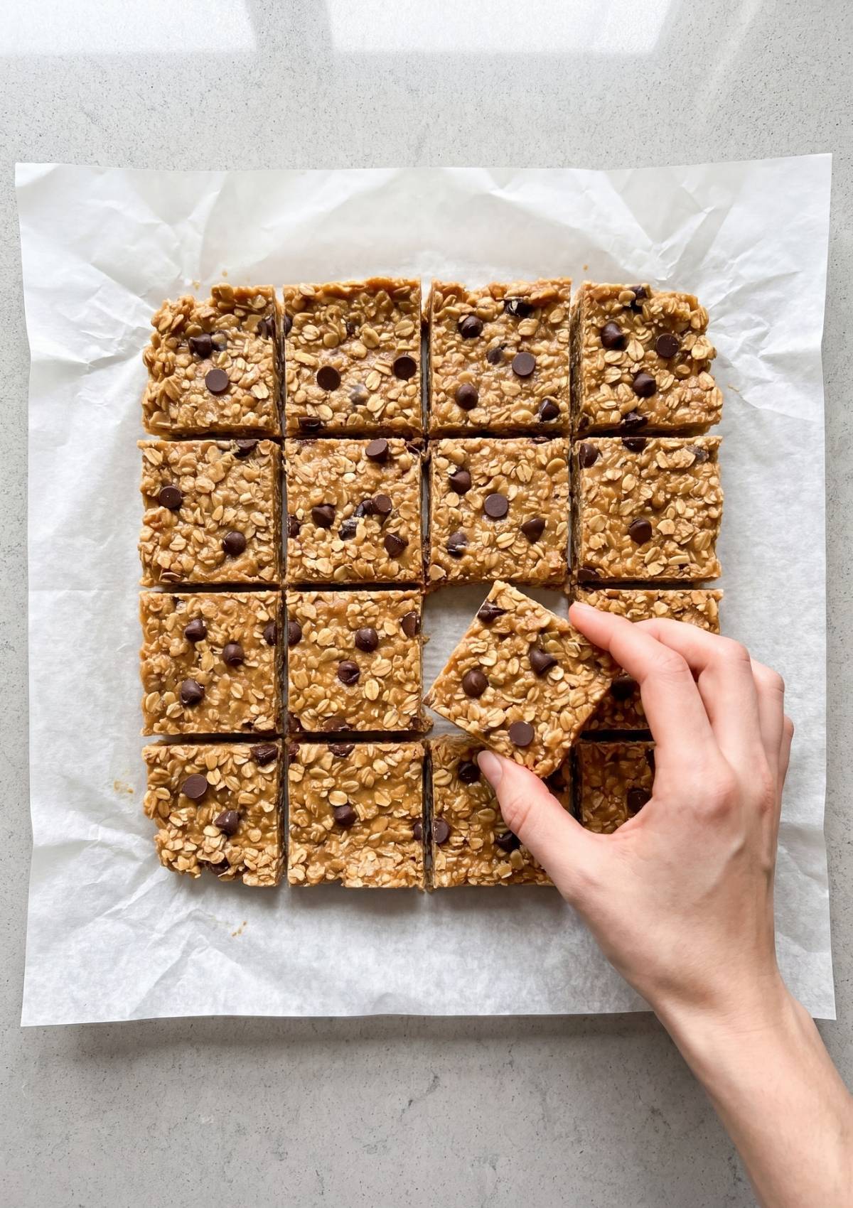 close up of no bake peanut butter oatmeal bars soft chewy texture with chocolate chips healthy snack
