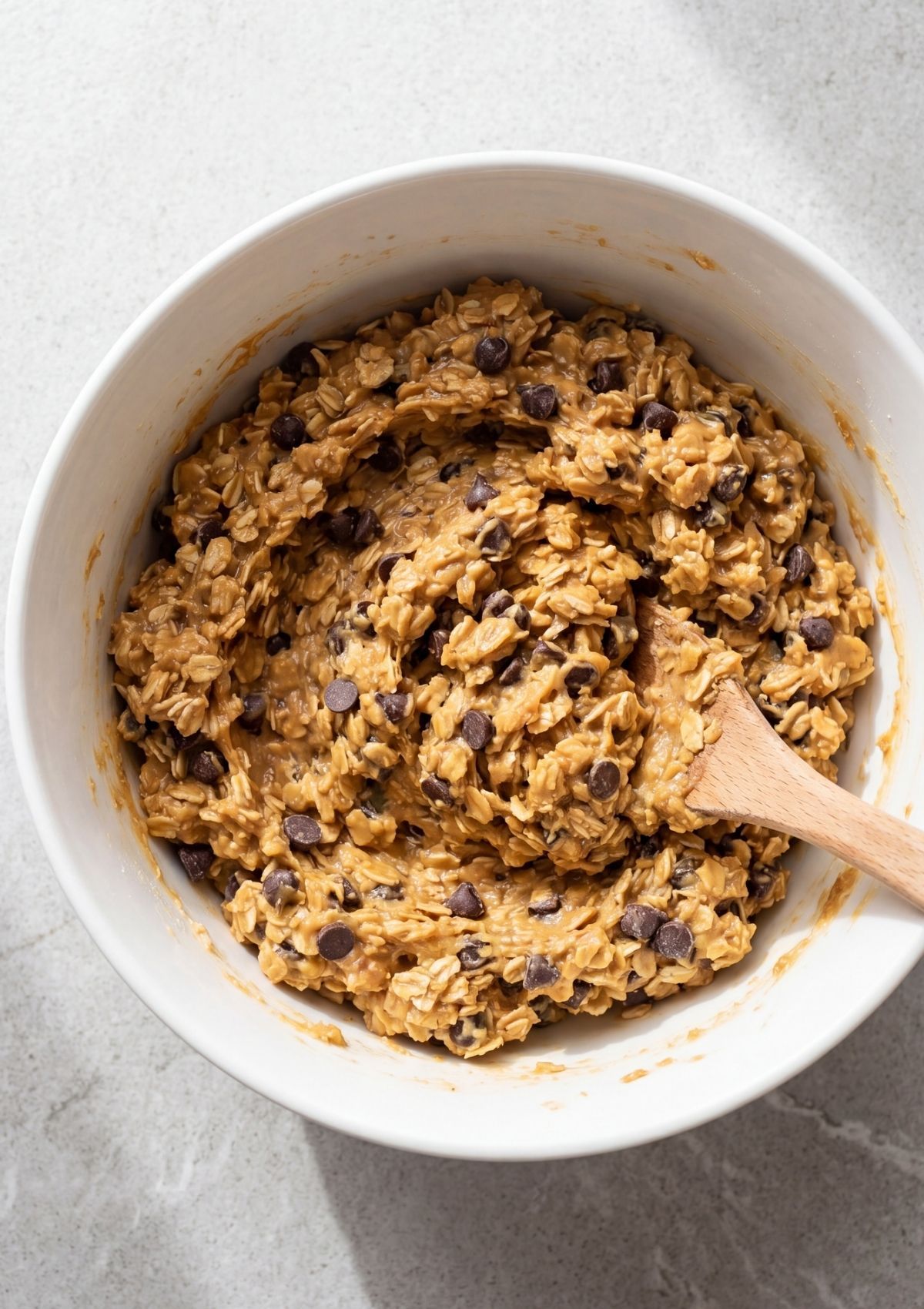 peanut butter oatmeal mixture pressed into pan with chocolate chips easy no bake dessert preparation