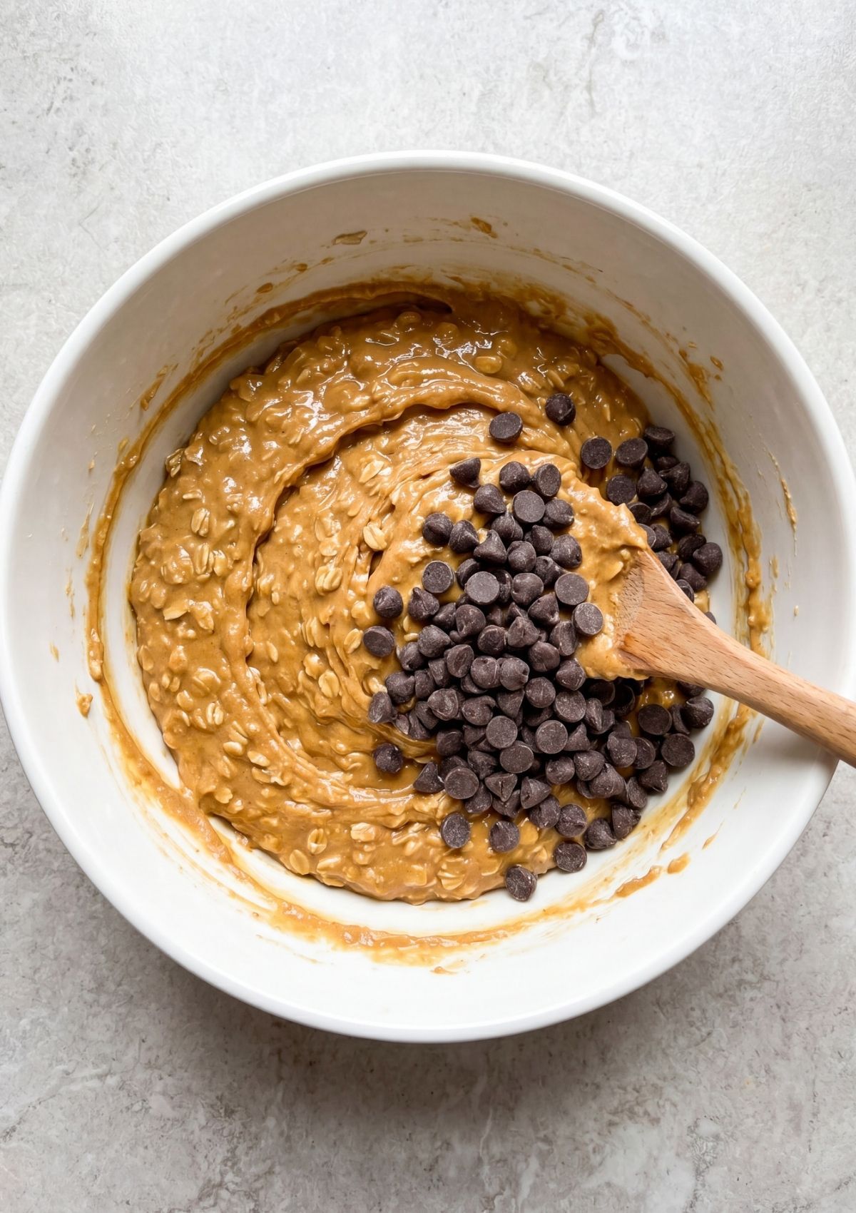 hand picking no bake peanut butter oatmeal bars from tray simple homemade snack ready to eat