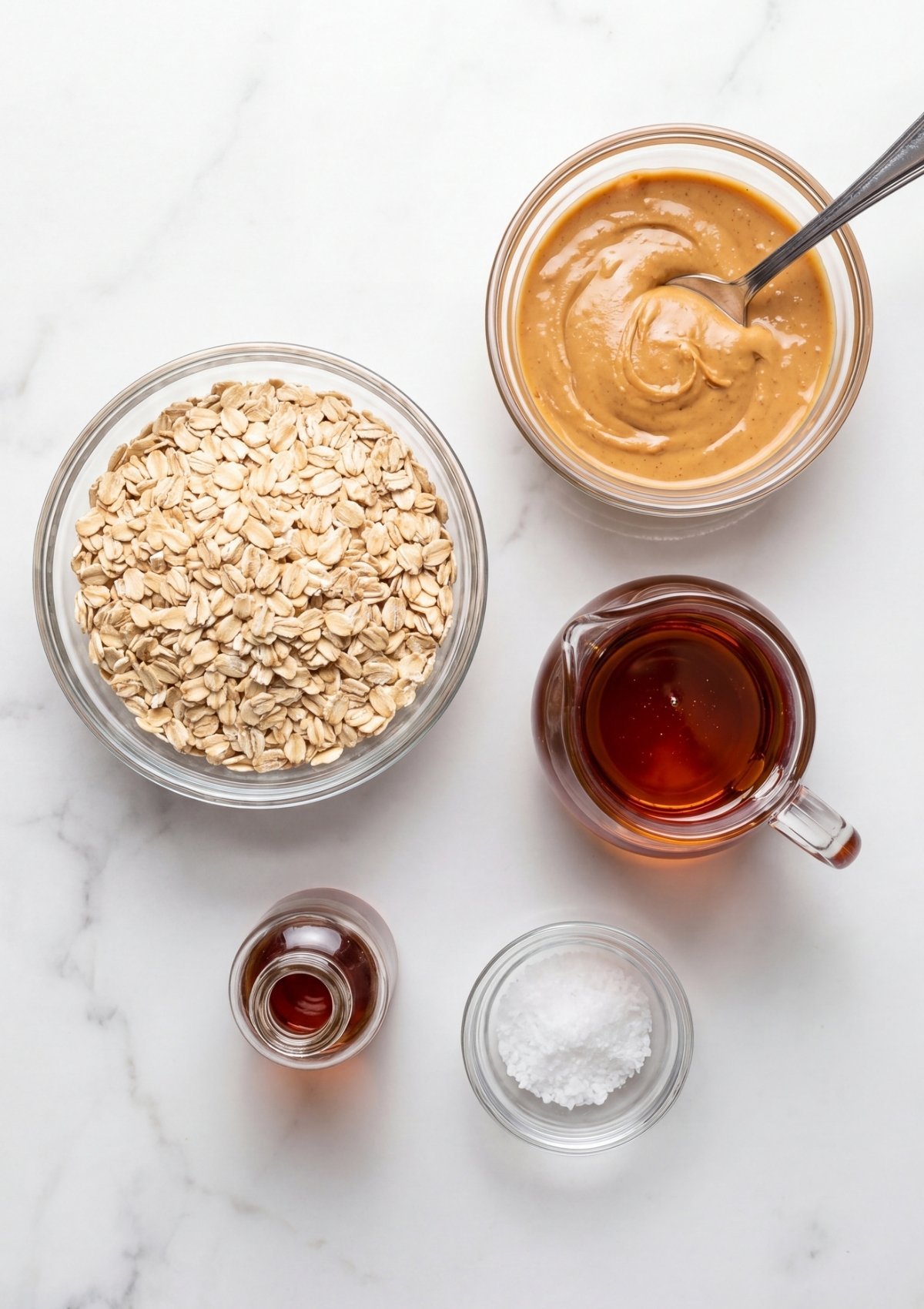ingredients for no bake oatmeal peanut butter bars oats peanut butter maple syrup and vanilla easy homemade snack