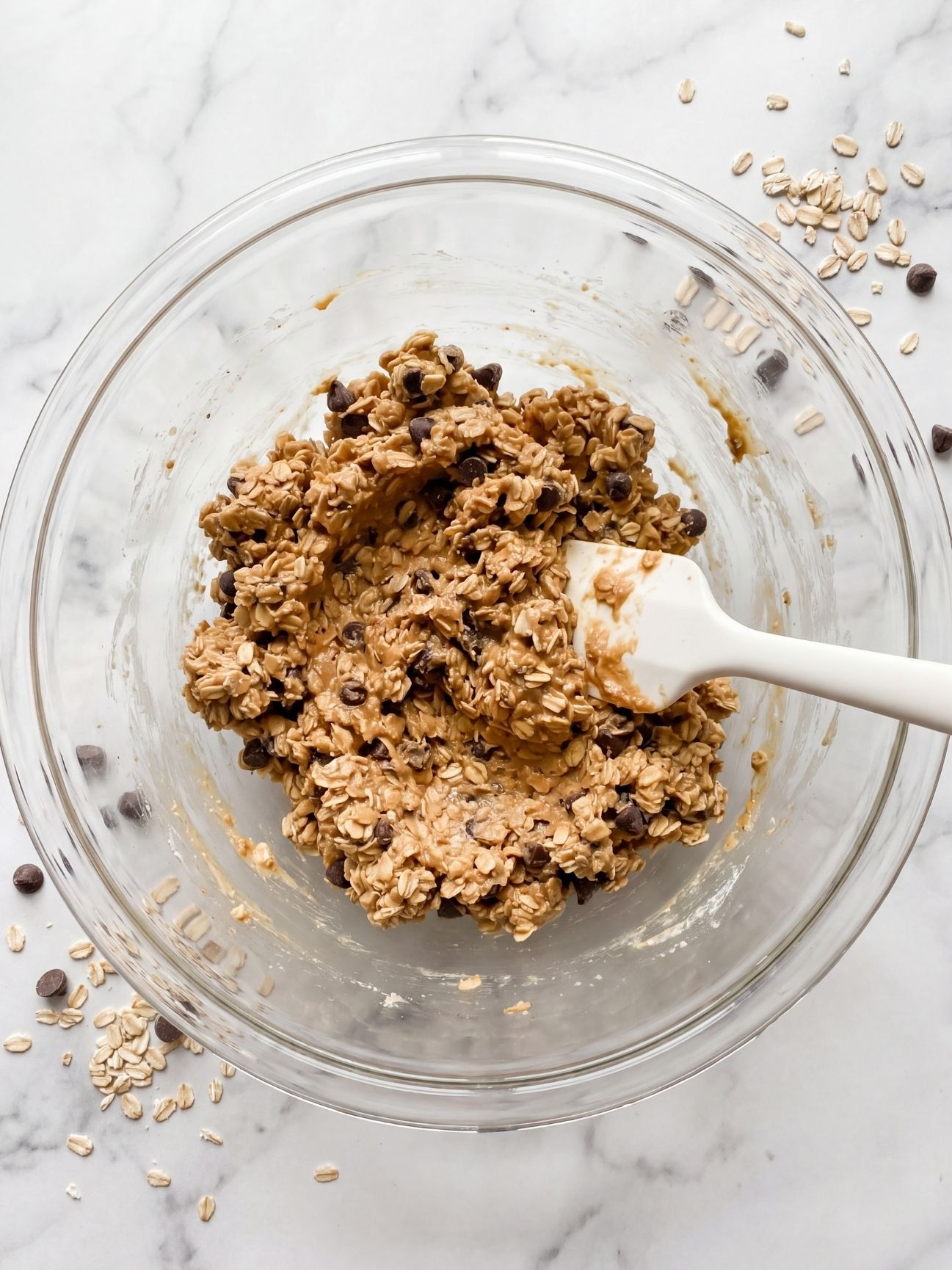 peanut butter oats chocolate chips mixture in bowl step by step peanut butter no bake balls recipe