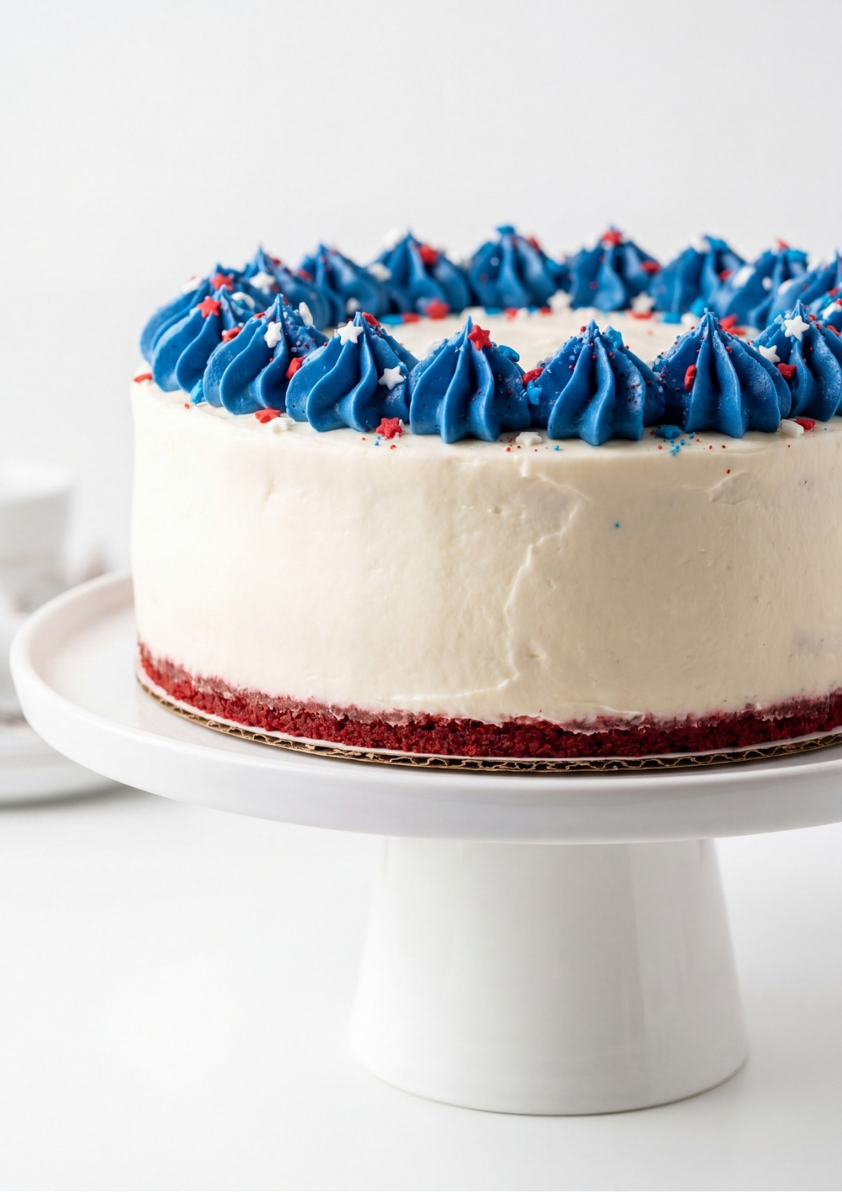 A top down view of smooth creamy cheesecake batter in a white bowl on a marble surface.